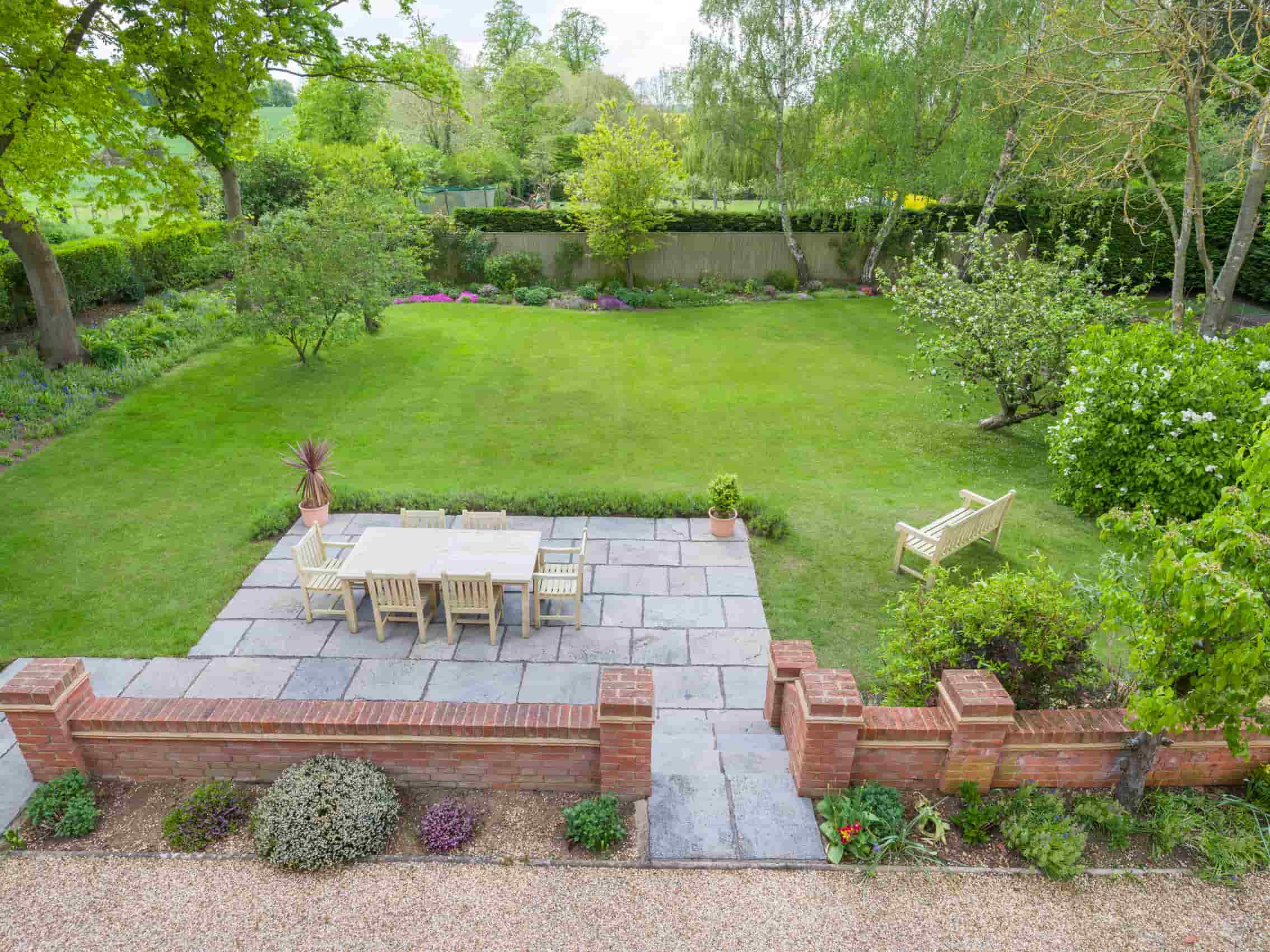 This is a landscaped garden. New slab patio area, newly constructed walls, and a shingle pathway
