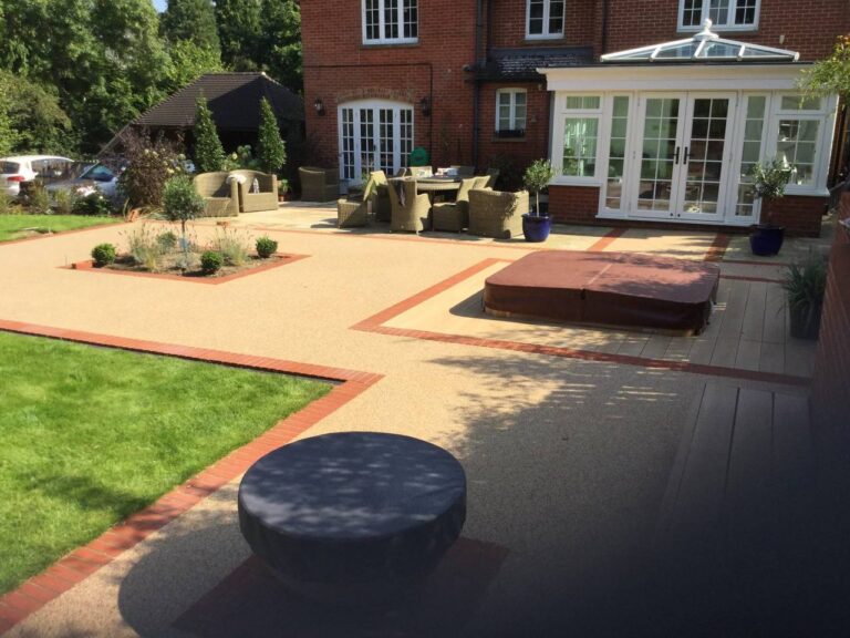 This is a resin patio installed outside a large house